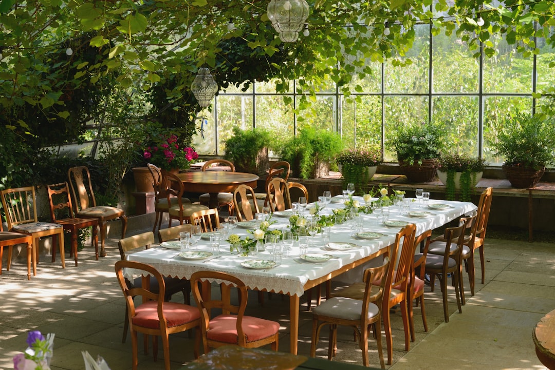 A festive wedding table in an evening mood greenhouse setting.
